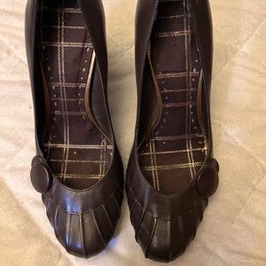 Brown leather BCBG heels with button detail, excellent condition. Size 8.5